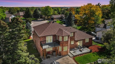 All-brick charmer on a cul-de-sac! This gorgeous home in the on The Olde Course At Loveland in Colorado - for sale on GolfHomes.com, golf home, golf lot