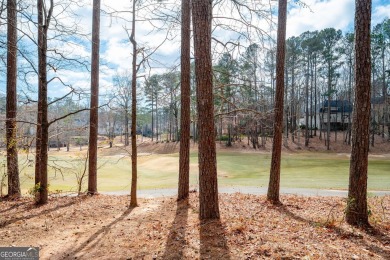 Stunning beauty surrounds this graceful home in Brookstone on Brookstone Golf and Country Club in Georgia - for sale on GolfHomes.com, golf home, golf lot