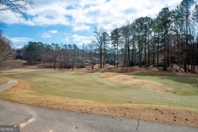 Stunning beauty surrounds this graceful home in Brookstone on Brookstone Golf and Country Club in Georgia - for sale on GolfHomes.com, golf home, golf lot