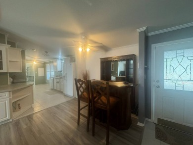 This one grabs your attention immediately as you approach the on Golden Lakes Golf Course in Florida - for sale on GolfHomes.com, golf home, golf lot