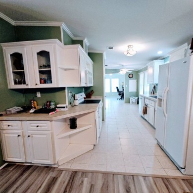 This one grabs your attention immediately as you approach the on Golden Lakes Golf Course in Florida - for sale on GolfHomes.com, golf home, golf lot