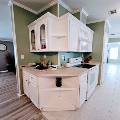 This one grabs your attention immediately as you approach the on Golden Lakes Golf Course in Florida - for sale on GolfHomes.com, golf home, golf lot