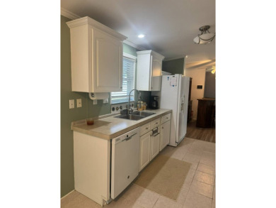 This one grabs your attention immediately as you approach the on Golden Lakes Golf Course in Florida - for sale on GolfHomes.com, golf home, golf lot