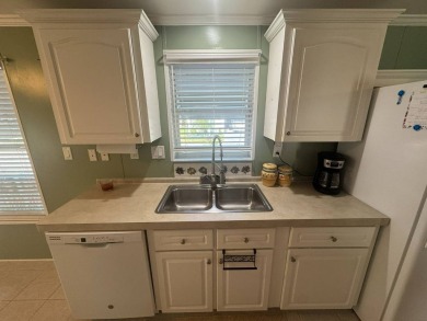 This one grabs your attention immediately as you approach the on Golden Lakes Golf Course in Florida - for sale on GolfHomes.com, golf home, golf lot