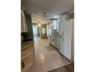 This one grabs your attention immediately as you approach the on Golden Lakes Golf Course in Florida - for sale on GolfHomes.com, golf home, golf lot