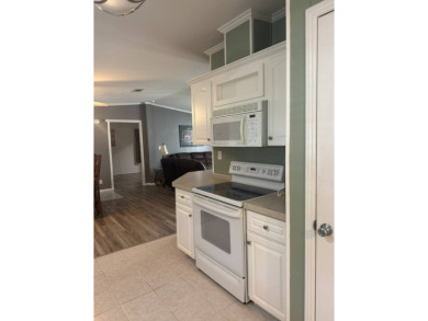 This one grabs your attention immediately as you approach the on Golden Lakes Golf Course in Florida - for sale on GolfHomes.com, golf home, golf lot