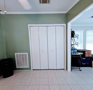 This one grabs your attention immediately as you approach the on Golden Lakes Golf Course in Florida - for sale on GolfHomes.com, golf home, golf lot