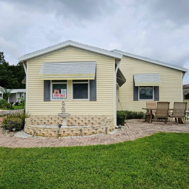 This one grabs your attention immediately as you approach the on Golden Lakes Golf Course in Florida - for sale on GolfHomes.com, golf home, golf lot