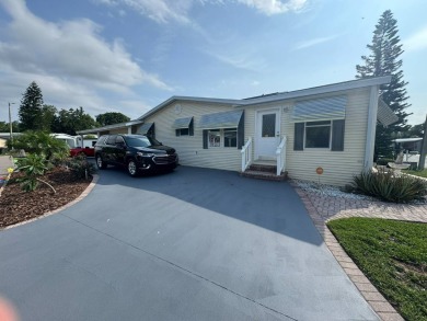This one grabs your attention immediately as you approach the on Golden Lakes Golf Course in Florida - for sale on GolfHomes.com, golf home, golf lot
