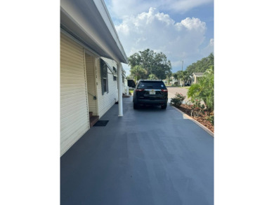 This one grabs your attention immediately as you approach the on Golden Lakes Golf Course in Florida - for sale on GolfHomes.com, golf home, golf lot