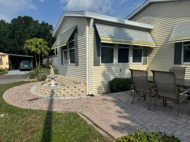 This one grabs your attention immediately as you approach the on Golden Lakes Golf Course in Florida - for sale on GolfHomes.com, golf home, golf lot