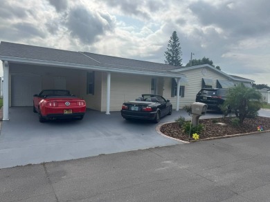 This one grabs your attention immediately as you approach the on Golden Lakes Golf Course in Florida - for sale on GolfHomes.com, golf home, golf lot