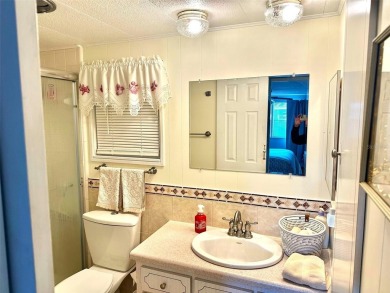 Charming and Impressive 2 bedroom, 1 1/2 Bath Doublewide, with on East Bay Golf Club in Florida - for sale on GolfHomes.com, golf home, golf lot