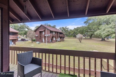 Discover the charm of this inviting 1-bedroom, 1-bath upstairs on Diamondhead Country Club in Mississippi - for sale on GolfHomes.com, golf home, golf lot