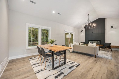 Discover your dream home with effortless living and modern on Oak Ridge Golf Club in Michigan - for sale on GolfHomes.com, golf home, golf lot