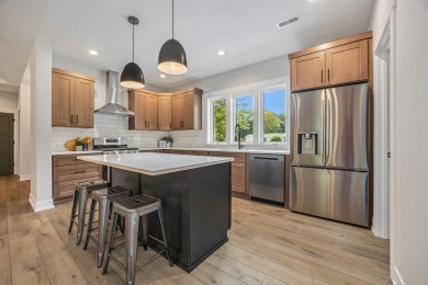 Discover your dream home with effortless living and modern on Oak Ridge Golf Club in Michigan - for sale on GolfHomes.com, golf home, golf lot