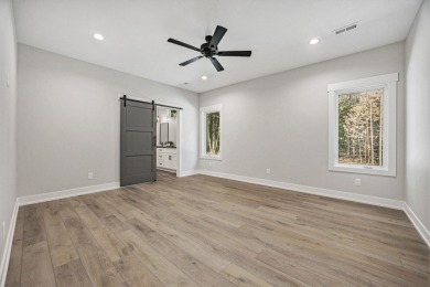 Discover your dream home with effortless living and modern on Oak Ridge Golf Club in Michigan - for sale on GolfHomes.com, golf home, golf lot