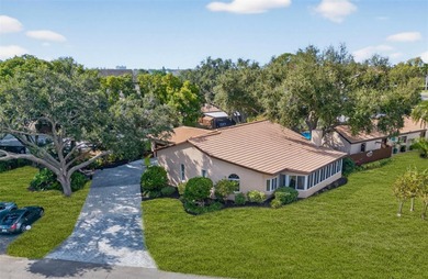 Uniquely settled in serene GOLF COURSE living and just minutes on Pasadena Yacht and Country Club in Florida - for sale on GolfHomes.com, golf home, golf lot