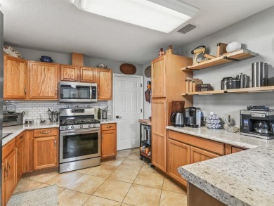 Welcome to this charming 2-bedroom, 2-bathroom ranch-style home on Oakleigh Executive Golf Course in Florida - for sale on GolfHomes.com, golf home, golf lot