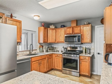 Welcome to this charming 2-bedroom, 2-bathroom ranch-style home on Oakleigh Executive Golf Course in Florida - for sale on GolfHomes.com, golf home, golf lot