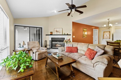 Set on a quiet street with peaceful views of Tradewinds Lake on Harbour Point Golf Club in North Carolina - for sale on GolfHomes.com, golf home, golf lot