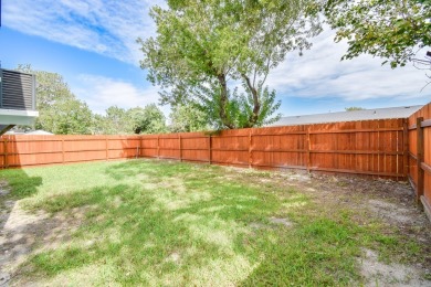 The home is elevated on pilings to allow for covered parking and on Rockport Country Club in Texas - for sale on GolfHomes.com, golf home, golf lot