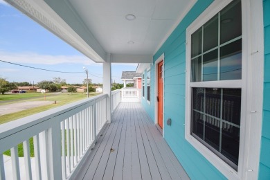 The home is elevated on pilings to allow for covered parking and on Rockport Country Club in Texas - for sale on GolfHomes.com, golf home, golf lot