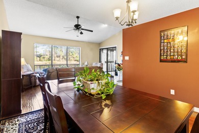 Set on a quiet street with peaceful views of Tradewinds Lake on Harbour Point Golf Club in North Carolina - for sale on GolfHomes.com, golf home, golf lot