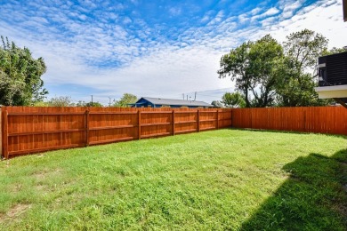 The home is elevated on pilings to allow for covered parking and on Rockport Country Club in Texas - for sale on GolfHomes.com, golf home, golf lot