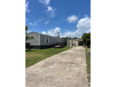 Discover this inviting 3-bedroom, 2-bathroom split-floorplan on Rockport Country Club in Texas - for sale on GolfHomes.com, golf home, golf lot
