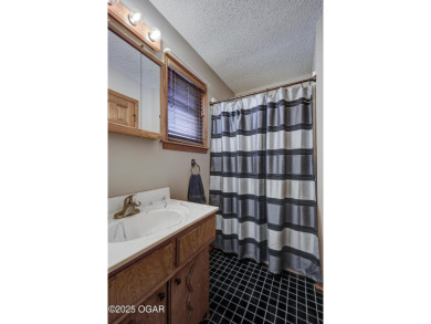 Impeccably Maintained Ranch on a  1/2 -Acre Lot and located on Baxter Country Club in Kansas - for sale on GolfHomes.com, golf home, golf lot