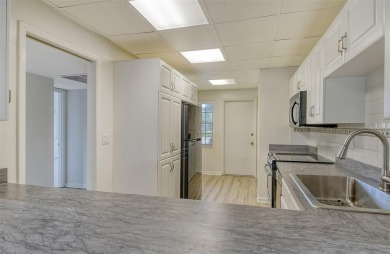 One or more photo(s) has been virtually staged. Rarely available on Palm Aire Country Club of Sarasota in Florida - for sale on GolfHomes.com, golf home, golf lot