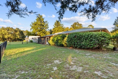 Welcome to this charming two-bedroom, one-bath home overlooking on Keystone Heights Golf and Country Club in Florida - for sale on GolfHomes.com, golf home, golf lot