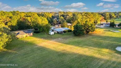 Welcome to this charming two-bedroom, one-bath home overlooking on Keystone Heights Golf and Country Club in Florida - for sale on GolfHomes.com, golf home, golf lot