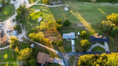 Welcome to this charming two-bedroom, one-bath home overlooking on Keystone Heights Golf and Country Club in Florida - for sale on GolfHomes.com, golf home, golf lot