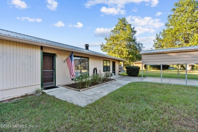 Welcome to this charming two-bedroom, one-bath home overlooking on Keystone Heights Golf and Country Club in Florida - for sale on GolfHomes.com, golf home, golf lot