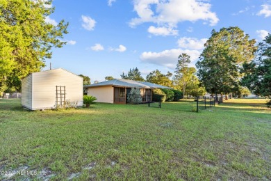 Welcome to this charming two-bedroom, one-bath home overlooking on Keystone Heights Golf and Country Club in Florida - for sale on GolfHomes.com, golf home, golf lot