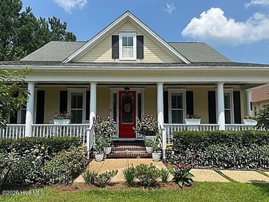 Welcome to this charming home with an inviting, rocking on Cape Fear National At Brunswick Forest in North Carolina - for sale on GolfHomes.com, golf home, golf lot