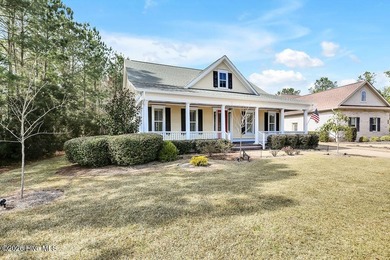 Welcome to this charming home with an inviting, rocking on Cape Fear National At Brunswick Forest in North Carolina - for sale on GolfHomes.com, golf home, golf lot