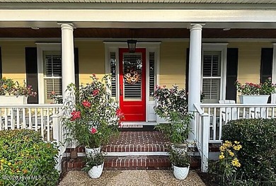 Welcome to this charming home with an inviting, rocking on Cape Fear National At Brunswick Forest in North Carolina - for sale on GolfHomes.com, golf home, golf lot