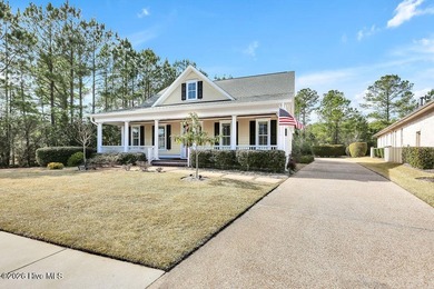 Welcome to this charming home with an inviting, rocking on Cape Fear National At Brunswick Forest in North Carolina - for sale on GolfHomes.com, golf home, golf lot