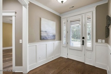 Welcome to this charming home with an inviting, rocking on Cape Fear National At Brunswick Forest in North Carolina - for sale on GolfHomes.com, golf home, golf lot