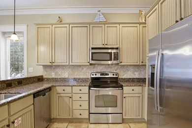 Set on a prime corner lot within the Bungalos at Sandestin, this on Sandestin Golf and Beach Resort - Raven in Florida - for sale on GolfHomes.com, golf home, golf lot