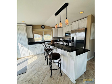 Golf course beauty with huge windows framing stunning views on Long Island Golf Course in Texas - for sale on GolfHomes.com, golf home, golf lot