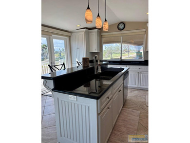 Golf course beauty with huge windows framing stunning views on Long Island Golf Course in Texas - for sale on GolfHomes.com, golf home, golf lot