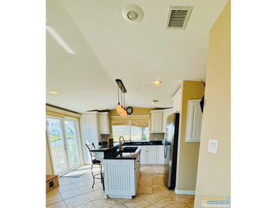 Golf course beauty with huge windows framing stunning views on Long Island Golf Course in Texas - for sale on GolfHomes.com, golf home, golf lot