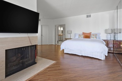 Step into this beautiful ground-floor condo at Desert Island on Desert Island Golf and Country Club in California - for sale on GolfHomes.com, golf home, golf lot