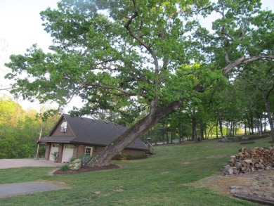 Nestled among impressive oaks and pines this beautifully on Oakridge Golf Course in Arkansas - for sale on GolfHomes.com, golf home, golf lot