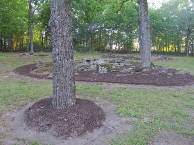 Nestled among impressive oaks and pines this beautifully on Oakridge Golf Course in Arkansas - for sale on GolfHomes.com, golf home, golf lot