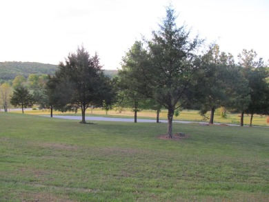 Nestled among impressive oaks and pines this beautifully on Oakridge Golf Course in Arkansas - for sale on GolfHomes.com, golf home, golf lot